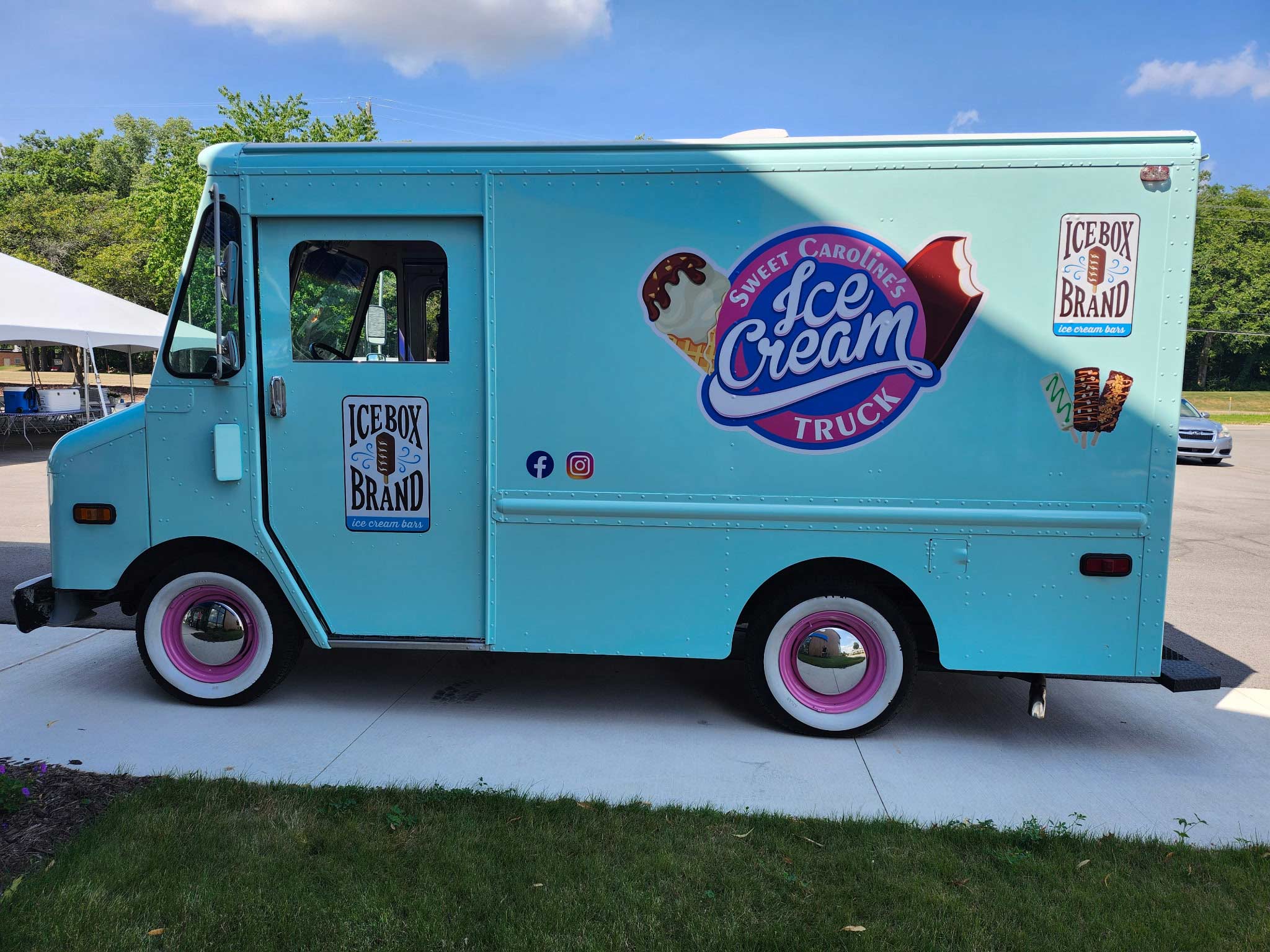 green sweet carolines ice cream truck near sidewalk